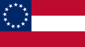 This However is the National Flag of the Confederacy. Or rather 1 of three. This was the first design. Notice how it is very similar in design to the  original American Flag.  With 13 stars representing the 13 states that were part of the Confederacy. When this design was done originally it contained 7, then moved to 9, then 11, finally to 13. Each addition represented the states that joined the confederacy. 